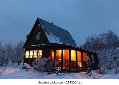 Country house (dacha) in winter dawn. Moscow region. Russia.