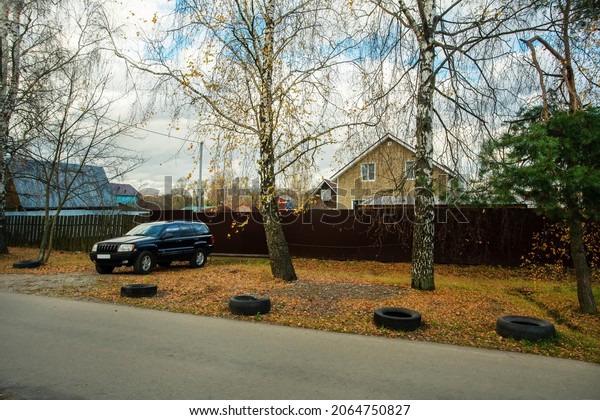 A country\
house not far from Moscow and an SUV nearby - autumn - Krasnogorsk\
district of the Moscow region. Now in a pandemic of Covid-19 , some\
people live all year round.