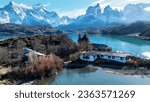 Country House Of Torres Del Paine In Puerto Natales Chile. Snowy Mountains. Glacier Landscape. Puerto Natales Chile. Winter Background. Country House At Torres Del Paine In Puerto Natales Chile.