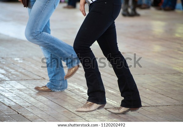 Country line dance and\
western boots
