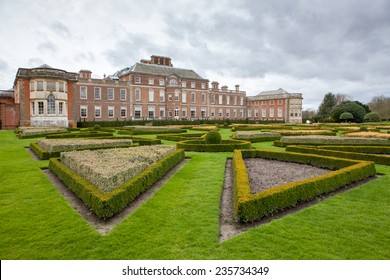 Country Manor In Britain Showing Landscaped Gardens And Hedges 