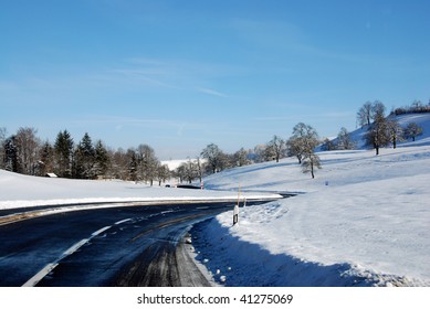 Country Meandering Road In Winter Sunny Morning