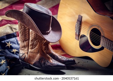 Country music festival live concert with acoustic guitar, antique american flag, cowboy hat and boots