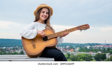 Country Music. Music Is My Life. Child With Acoustic String Instrument. Have Fun On Party. Guitar Player Or Guitarist. Happy Singer With Guitar. Girl Playing Guitar. Musical School Concept.