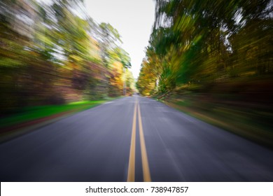 Country Road In Autumn With Motion Blur