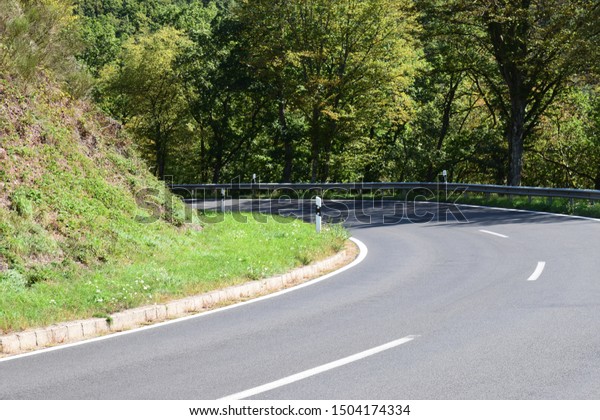 country road curve in rural\
Eifel