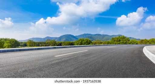country road and green mountains in summer.