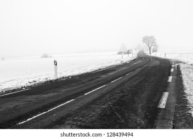 Country road in Lorraine, between the snow covered fields - Powered by Shutterstock