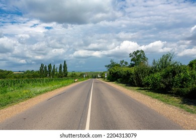 A Country Road Stretching Into The Sky.