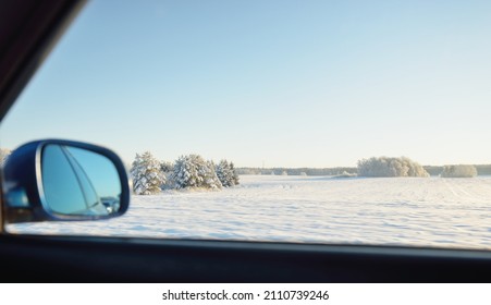 Country Road Through The Snow-covered Fields, Rural Area. View From Car. Snow Drifts. Europe. Nature, Christmas Vacations, Remote Places, Winter Tires, Dangerous Driving Concept