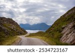 Country Road to Torridon with dramatic clouds and mountains