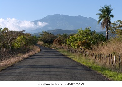 Country road in western Panama. The 'Volcan Baru' in the background is the best known volcano in Panama.  - Shutterstock ID 458274673
