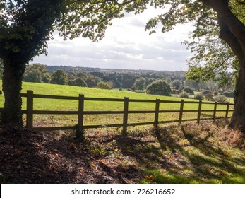 Country Side Open Rolling Fields Below With Wooden Fence Up Front; Essex; England; UK