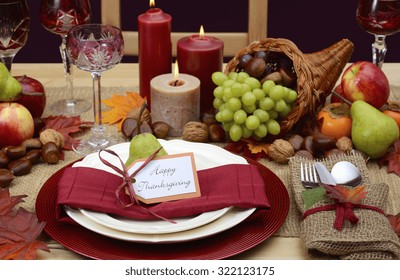 Country Style Rustic Thanksgiving Table With Place Setting, Cornucopia, Candles And Autumn Fruit Centerpiece. 