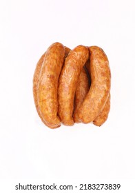 Country Style Smoked Sausage In Rings, Isolated On A White Background. Traditional Polish Meat Sausage With Natural Garlic Aroma, A Packshot Photo For Package Design, Template.