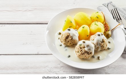 Country Style Table Setting With Meatballs In Creamy Caper Sauce And Potatoes. In German It Called Königsberger Klopse.