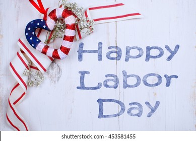 Country style USA patriotic decoration of heart shape painted with stars and stripes theme on rustic, whitewashed wooden background with a cheerful red and white ribbon with flowers labor day message - Shutterstock ID 453581455