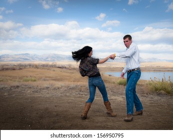 Country swing dancing at the foothill of mountains.