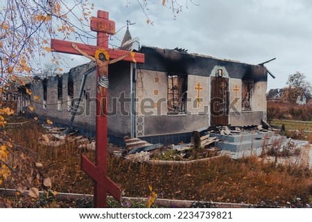 Countryside. Damaged after the shelling of the Orthodox Church. Holes from bullets and shrapnel in the fence. War in Ukraine. Russian invasion of Ukraine. Terror of the civilian population