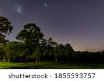 A countryside landscape at Poppethead Reserve under the night sky at Kitchener, near Cessnock, in the Hunter Valley, NSW, Australia.