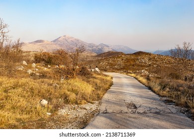 Countryside road in Croatian mountains. Evening time.