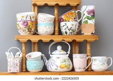 Countryside Style Collection Of Tea Cups On A Rustic Wooden Shelf .