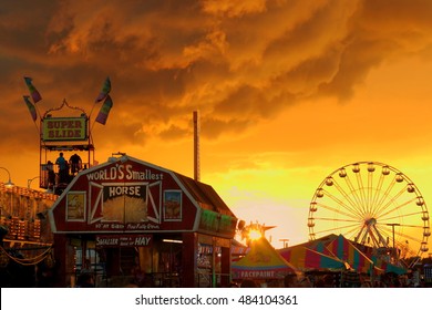 County Fair Midway At Sunset With Approaching Storm