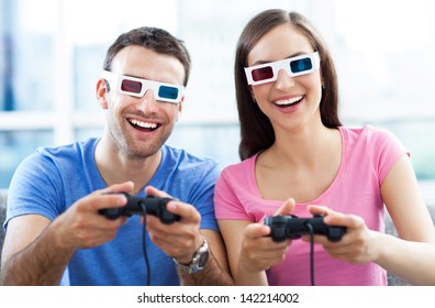 Couple In 3d Glasses Playing Video Games