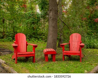 Couple Of Adirondack Chairs In A Quiet Peaceful Location