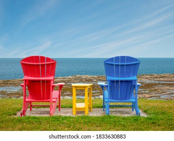 Couple Of Adirondack Chairs In A Quiet Peaceful Location