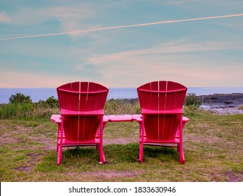 Couple Of Adirondack Chairs In A Quiet Peaceful Location