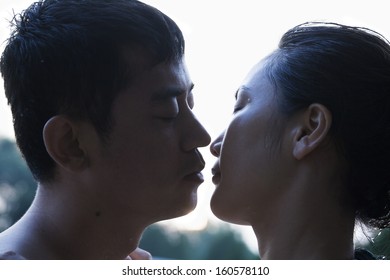 Couple Almost Kissing