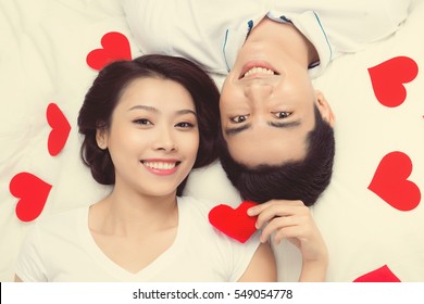 Couple Of Asian Lovers At The Beginning Of Love Story Having Fun Together.