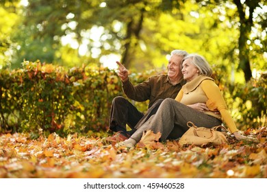 Couple In Autumn Park