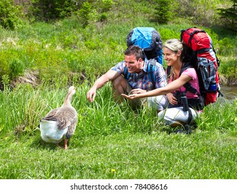 Couple with backpacks in the park. Adventure. - Powered by Shutterstock