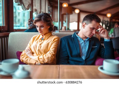 Couple In A Bad Mood Sitting In Restaurant