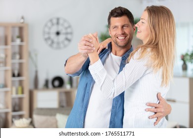 Couple Ballroom Dancing In The Home