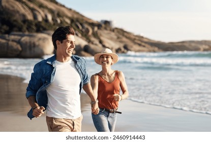 Couple, beach and holding hands in running with holiday or vacation, ocean and energy outdoor. People on romantic date, summer and happy for bonding, smile and sea with honeymoon, fun and freedom - Powered by Shutterstock