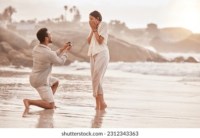 Couple at beach, surprise proposal and engagement with love and commitment with ocean and people outdoor. Travel, seaside and man propose marriage to woman, wow reaction and happiness with care