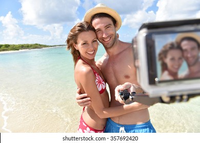 Couple At The Beach Taking Selfie Picture
