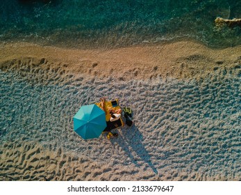 Couple At The Beach Under Sun Umbrella Sea Vacation Directly Above Copy Space