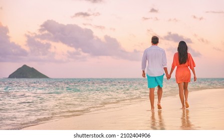 Couple Beach Vacation Travel Happy Together Romantic Honeymoon In Lanikai, Oahu, Hawaii. Woman In Dress, Man Wearing Shirt. Beautiful Sunset Stroll Lovers In Love.