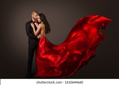 Couple Beauty Portrait, Beautiful Woman Dancing In Red Dress And Elegant Man, Cloth Fluttering On Wind