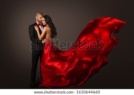 Couple Beauty Portrait, Beautiful Woman Dancing in Red Dress and Elegant Man, Cloth Fluttering on wind