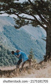 Couple Being Silly On A Mountain In Summer