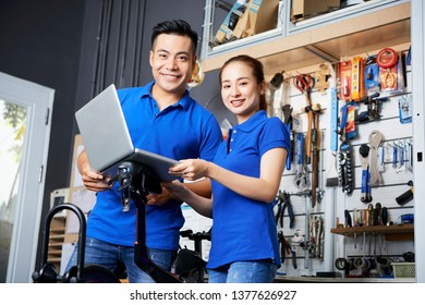 Couple in a bicycle repair shop - Powered by Shutterstock