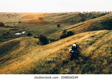 couple of bikers riding motorcycle with sunset nature ladscape. travel concept. aireal view