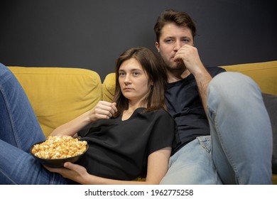 Couple Bored Watching Tv Movie Hugging Lying On Couch With Popcorn In Hands, YouTube Channel, Online Broadcast. Evening Entertainment For Young Family. Unhealthy Habits Lead To Weight Gain