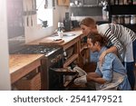 Couple, bread and oven with baking tray in kitchen for home made wheat, snack or meal together. Man, woman or bakers with recipe, mini loaf or sourdough for cooking creation, breakfast or morning