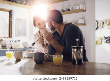 Couple, breakfast or eating cereal together at table with love, care or juice for fiber in meal in home. Romantic people, smile and healthy snack for bonding, nutrition and food in happy marriage - Powered by Shutterstock